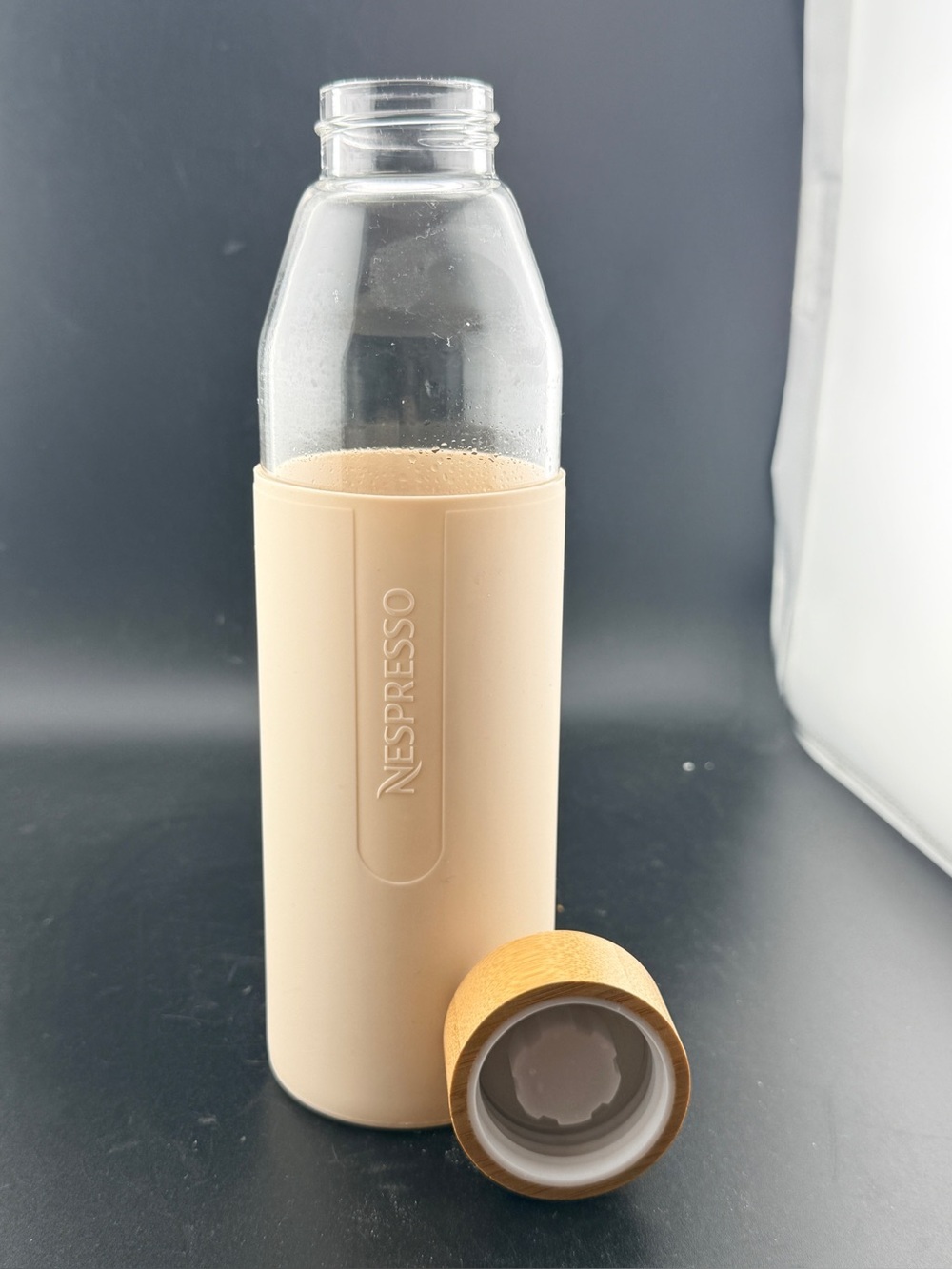 Nespresso Glass Bottle with Beige Sleeve and Tan Cap